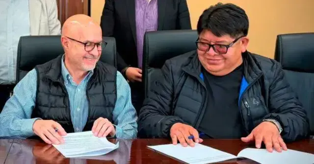 El ministro Lupo y el dirigente Edson Valdez.